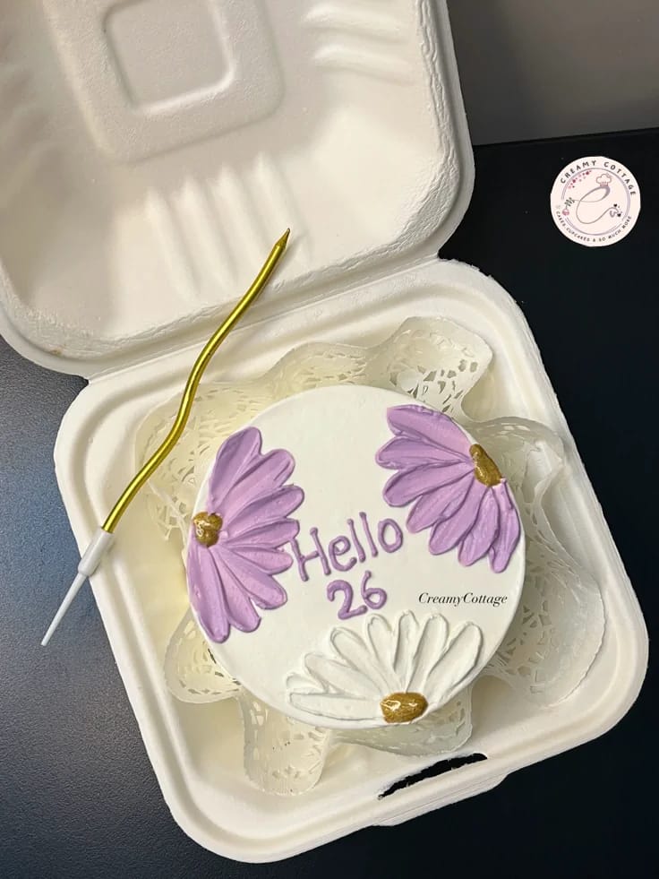 Mini white bento cake hand-painted with purple and white daisy flowers, a flower theme bento cake in Bahrain.