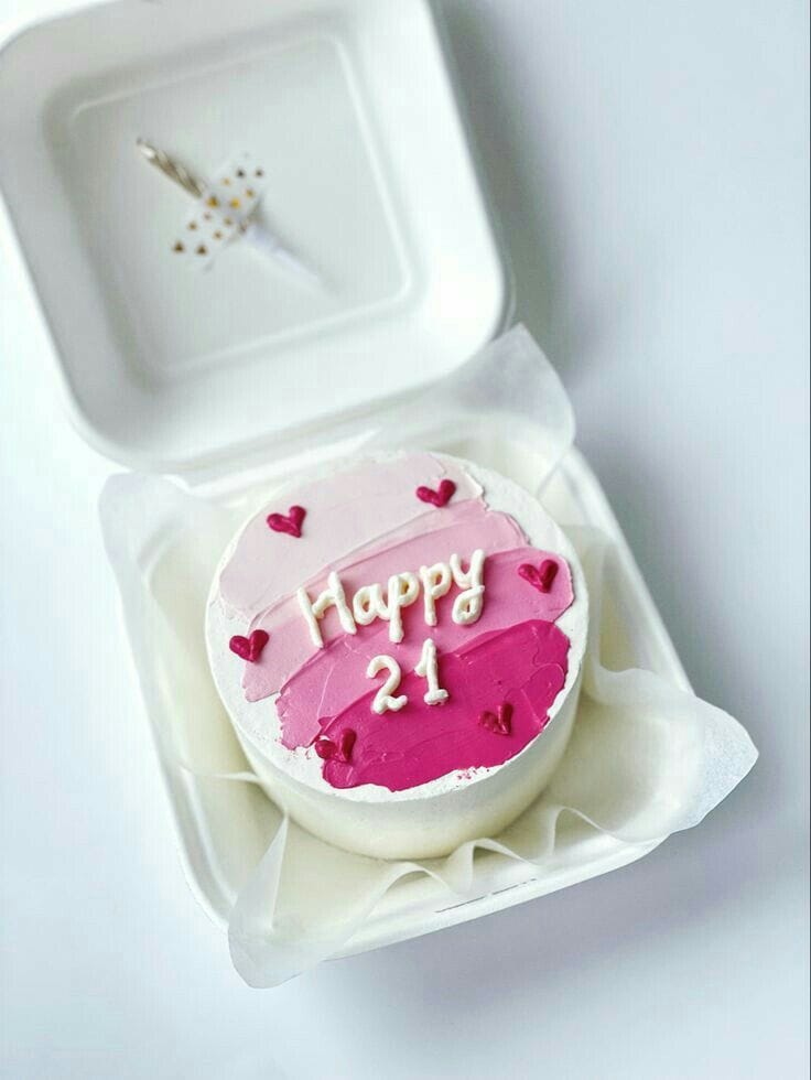 Mini bento cake with a pink ombre buttercream finish and small red hearts, a birthday bento cake gift in Bahrain.