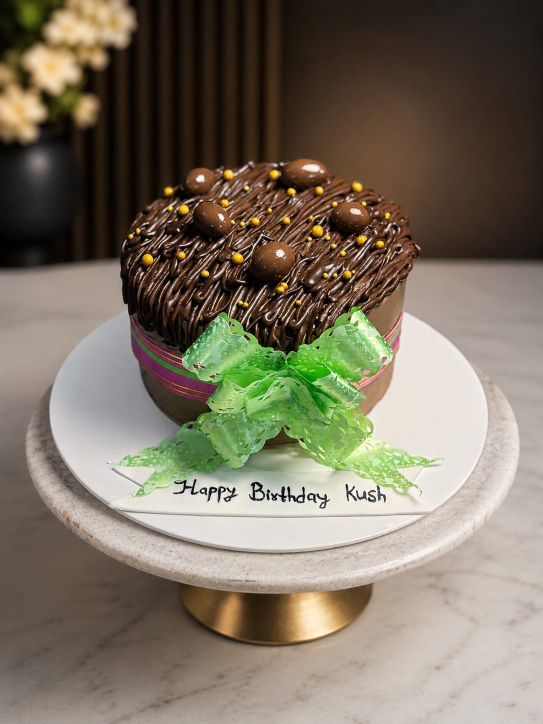 Chocolate cake with textured chocolate buttercream, chocolate pearls and a green ribbon bow, a CakeCanva chocolate cake design in Bahrain.