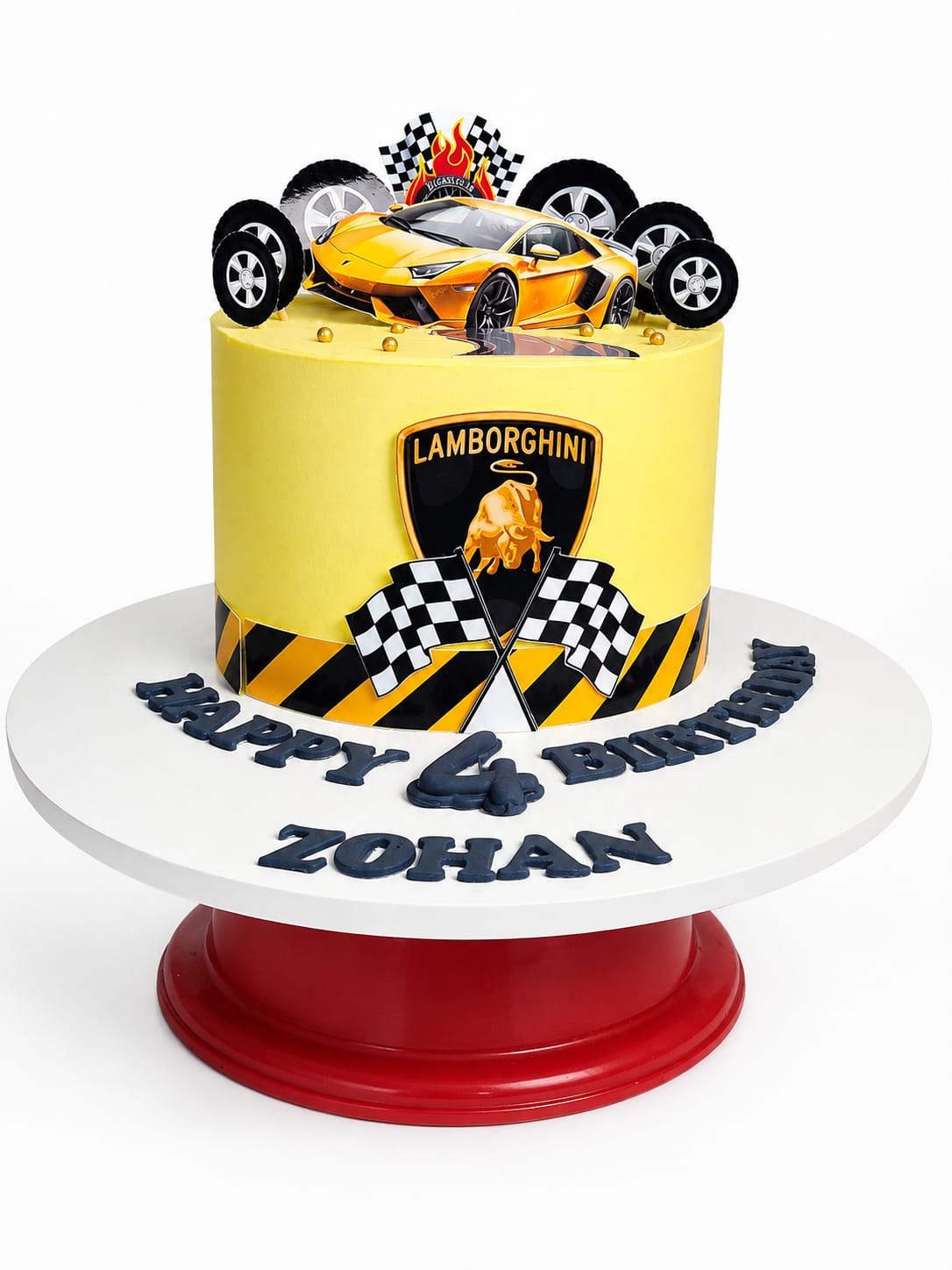 Yellow buttercream birthday cake topped with an orange Lamborghini toy car, checkered racing flags, and tire decorations, a car-themed custom cake in Bahrain.